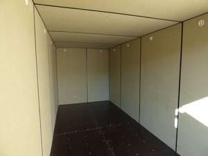 A steel storage unit lined with insulated board then covered with waterproof MDF.