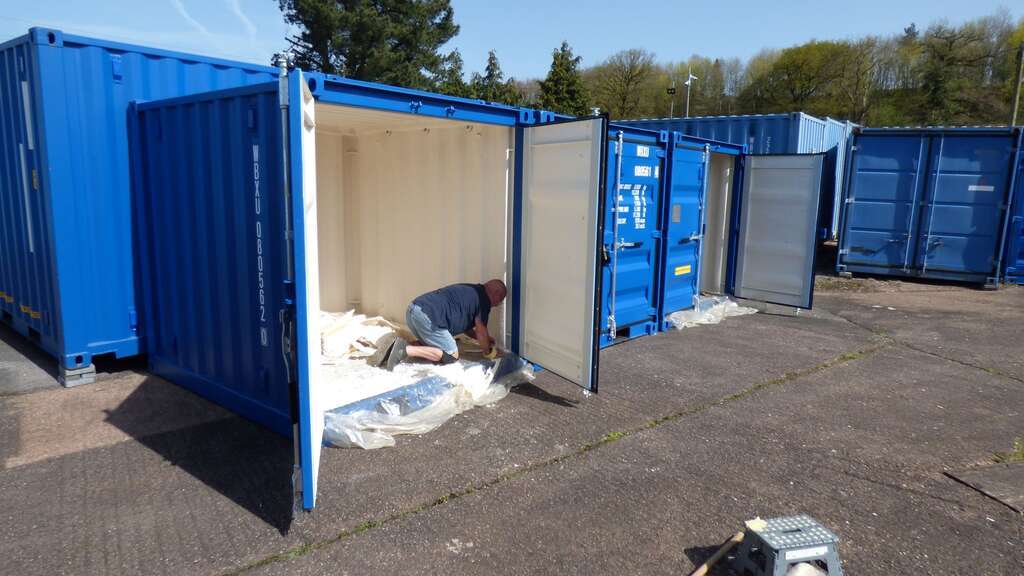 Cutting in freshly sprayed foam in a 8 x 7 self storage unit.