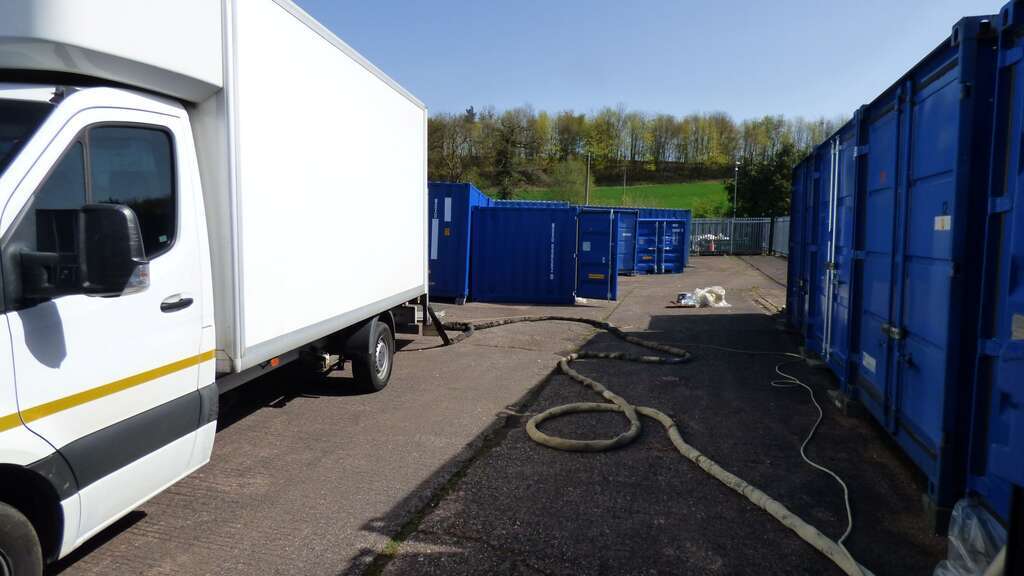 Newly delivered self storage units being lined with PU spray foam.