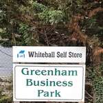 The main road entrance sign for Greenham Business Park and Whiteball Self Storage.
